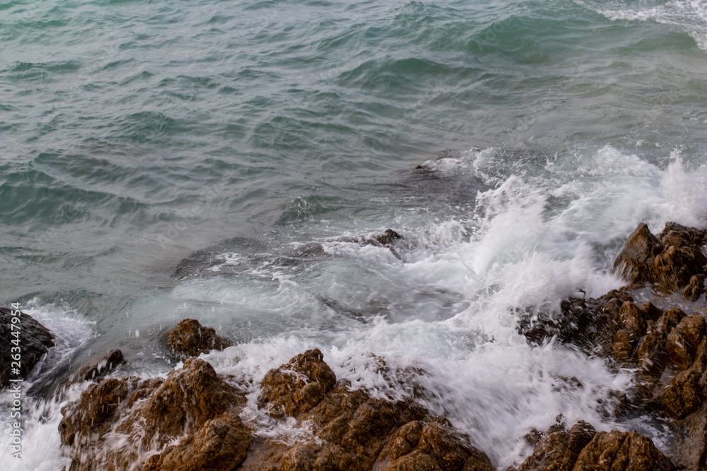 The ocean waves hit the rocks on the rocky beach in the morning, Ocean waves hit the rocks at the beach. The ocean waves hit the rocks on the rocky beach in the morning, Ocean waves hit the rocks at the beach.