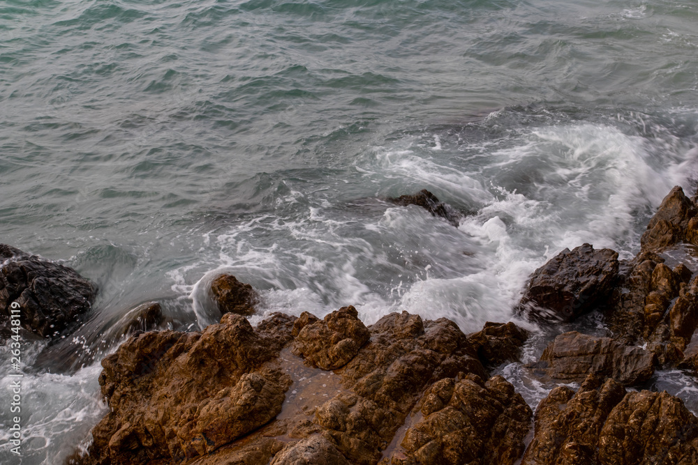 The ocean waves hit the rocks on the rocky beach in the morning, Ocean waves hit the rocks at the beach. The ocean waves hit the rocks on the rocky beach in the morning, Ocean waves hit the rocks at the beach.