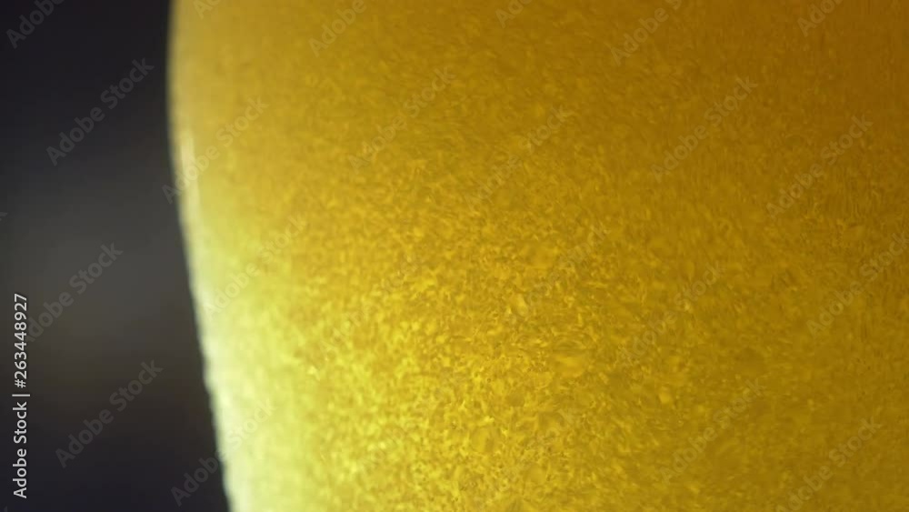 Cold light beer poured into a glass on a dark background. 4K UHD 3840x2160 Cold light beer poured into a glass on a dark background. 4K UHD 3840x2160