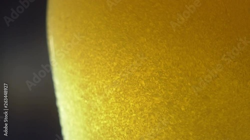 Wallpaper Mural Cold light beer poured into a glass on a dark background. 4K UHD 3840x2160 Torontodigital.ca