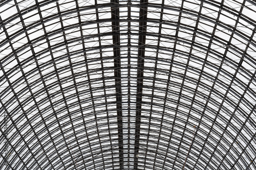 Wide angled view to hemispherical ceiling of glass and metal in modern building as background, texture (abstract)