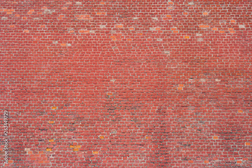 Old grungy red brick wall as texture, background