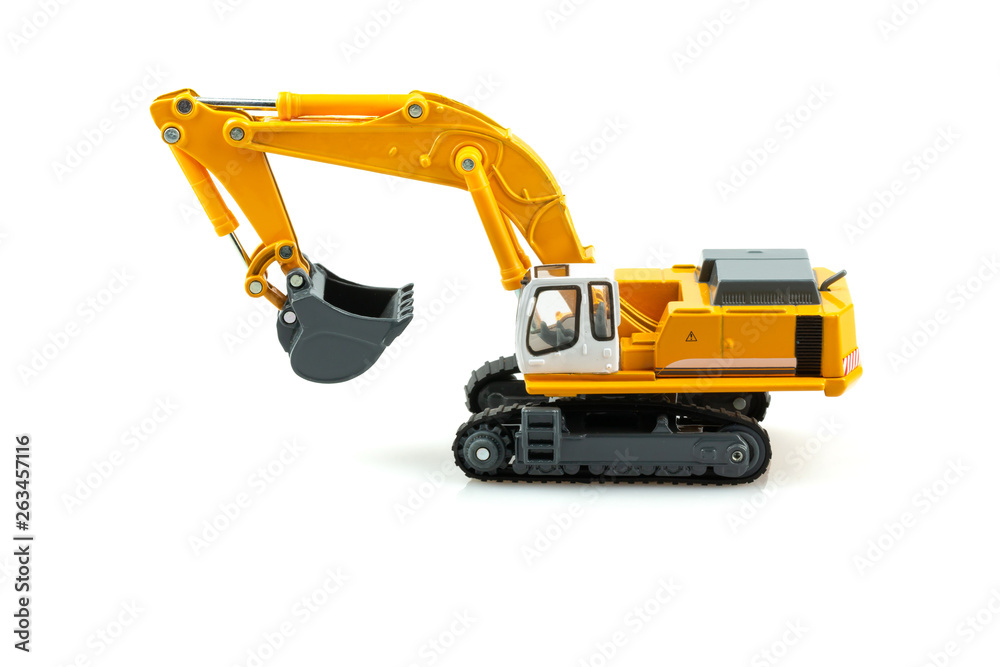 Yellow excavator model toy isolated on white background. Yellow excavator model toy isolated on white background.