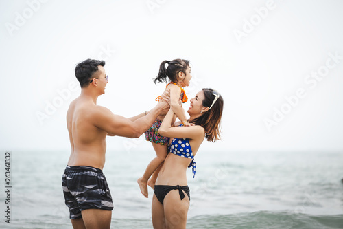 Asian family on beach