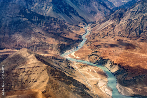 Confluence of the Indus and Zanskar Rivers are two different colors of water , between Kargil and leh,India