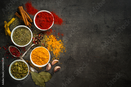 Fototapeta Naklejka Na Ścianę i Meble -  Set of various spices on black background.