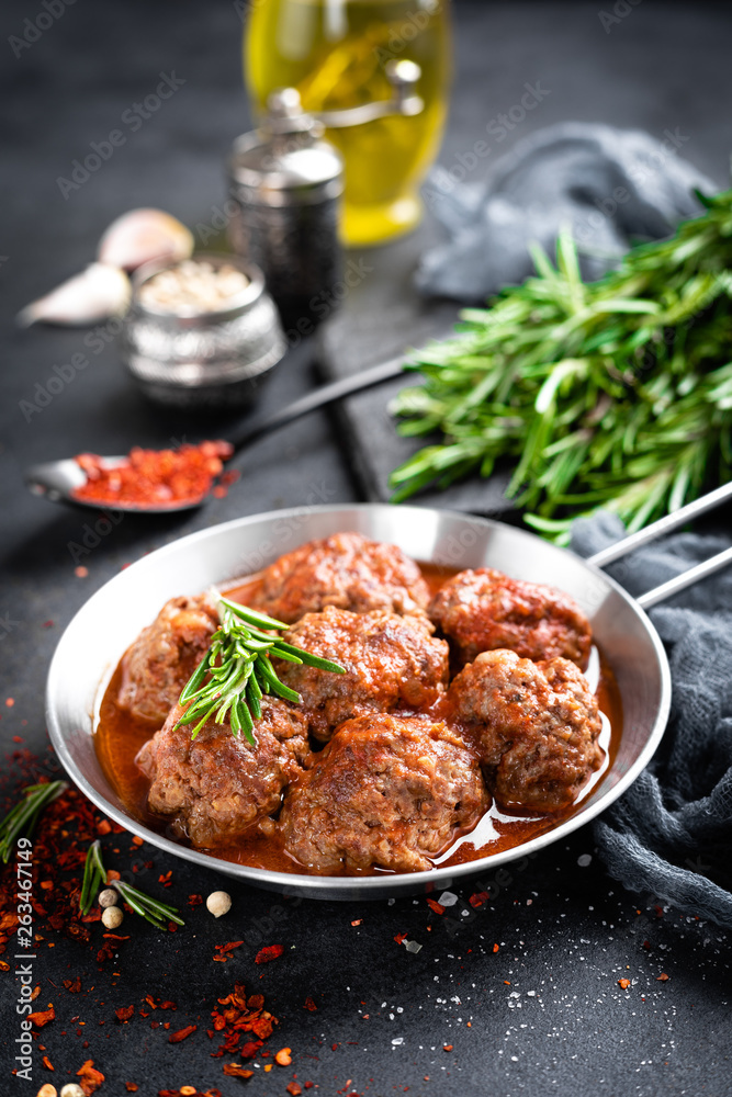 Beef meatballs with spices in tomato sauce