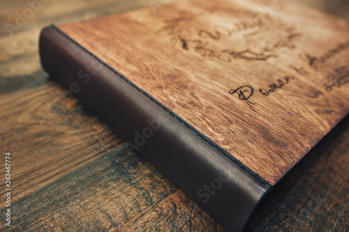 фотографія Leather binding wood book.