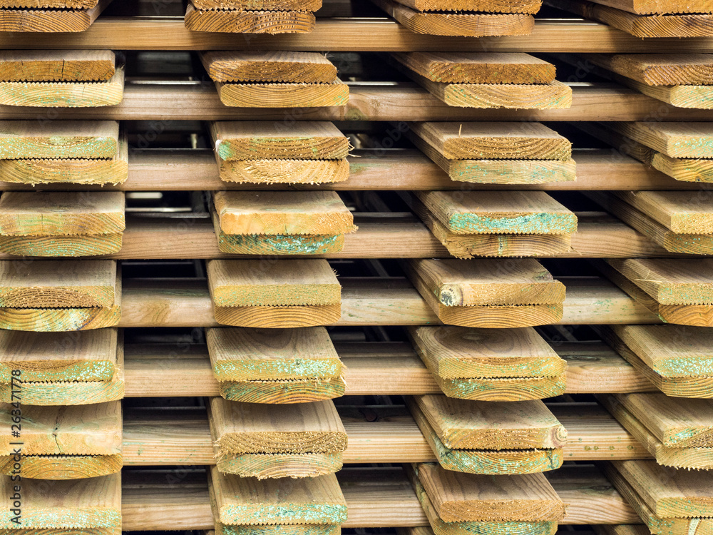 Wooden planks sorted in a pile