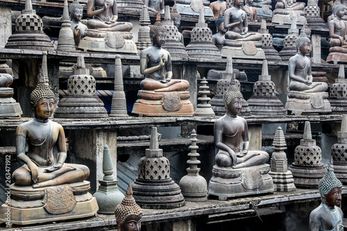 Buddha statues in Gangaramaya Temple in Colombo photo