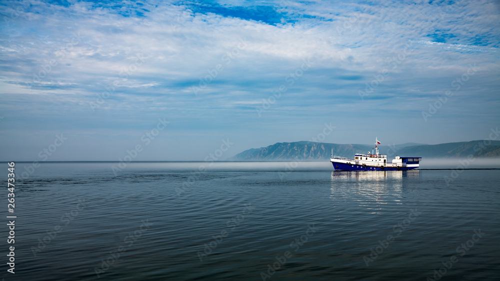 Fototapeta premium Ship on Misty Lake Baikal in Siberia