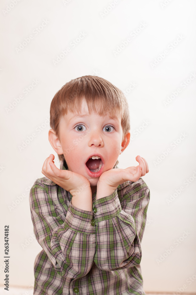 the boy is very surprised on white background the boy is very surprised on white background