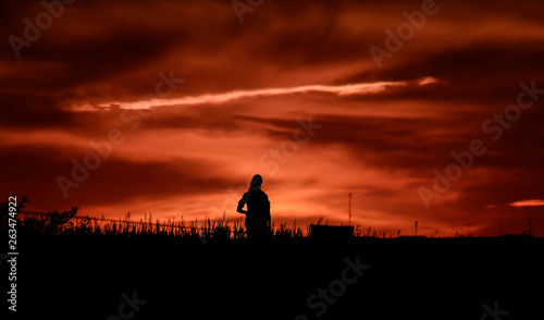 Girl silhouette at sunset