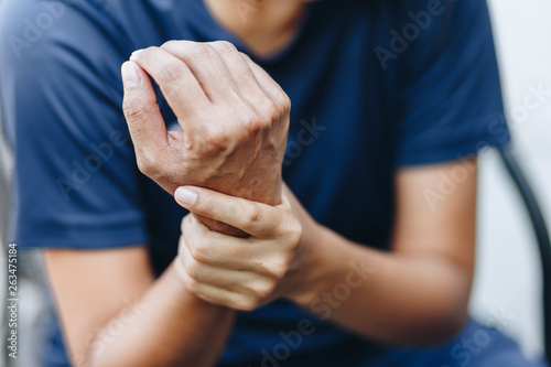 Close up young woman wrist pain, health care concept