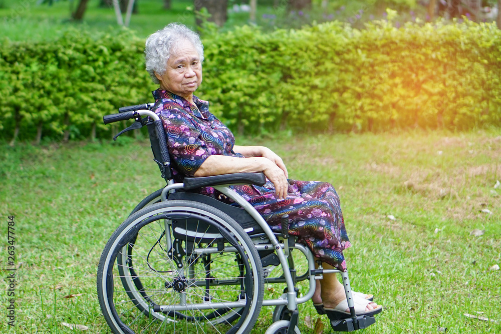 Asian senior or elderly old lady woman patient on wheelchair in park :  healthy strong medical concept. Stock Photo | Adobe Stock