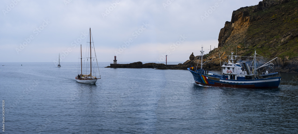 Fototapeta premium motorboat and sailboat, fishing boat on the coast of the Cantabrian Sea, Basque Country