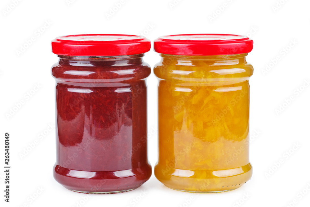 Glass jars with peach and strawberry jam on white background Glass jars with peach and strawberry jam on white background