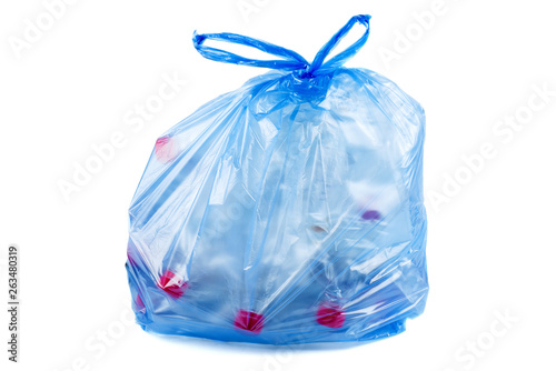 Blue plastic garbage bag with used PET bottles isolated on white background