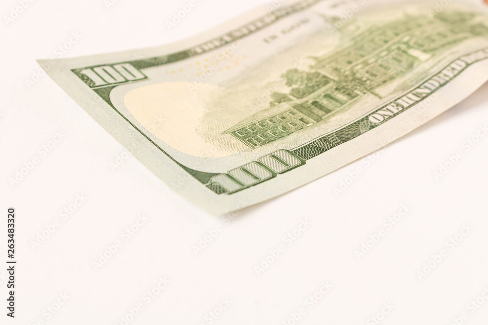 100 dollar bill. Isolated on white background. Selective focus. 100 dollar bill. Isolated on white background. Selective focus.