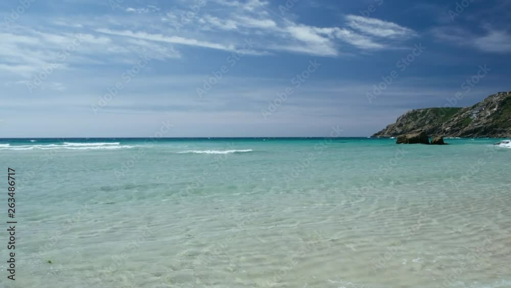 idyllic tropical looking coastline at Porthcurno, South Cornwall on a sunny June day. idyllic tropical looking coastline at Porthcurno, South Cornwall on a sunny June day.