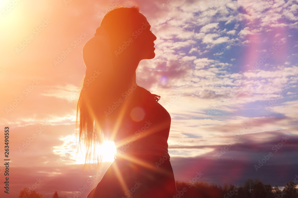 Young beautiful girl in dresses on nature. A girl in a hat walks in the park. Young woman on a picnic with a basket outside the city. Young beautiful girl in dresses on nature. A girl in a hat walks in the park. Young woman on a picnic with a basket outside the city.