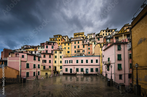 View of a square in Manarola after a rain with dark heavy sky. Manarola is one of the five towns of Cinque Terra located on the coast of Ligurian Sea in Italy.