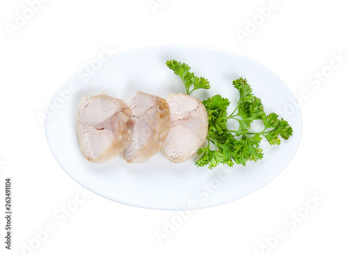 Cooked slices of rabbit meat isolated on white background on white plate with parsley,. Top view. With clipping path