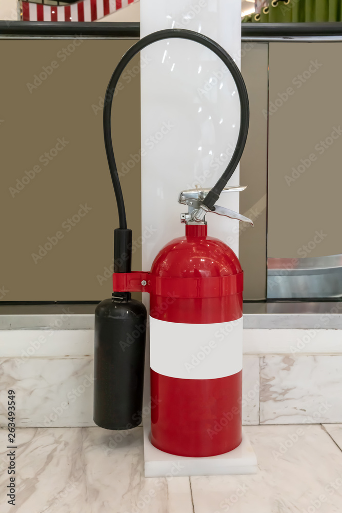 Obraz premium Fire protection equipment, Fire extinguisher on white stand