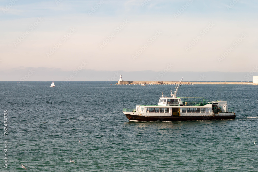 SEBASTOPOL, RUSSIA - NOVEMBER 4,2018: Artillery bay of Black sea, view of passenger boat.