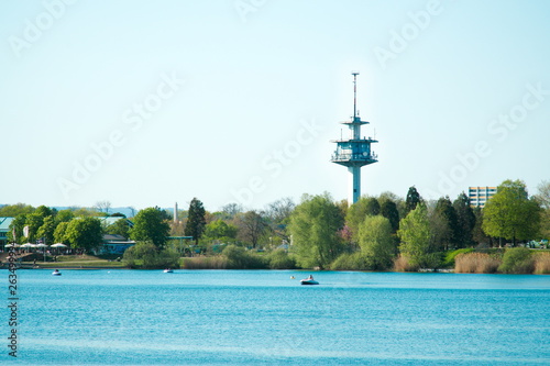 Fernsehturm hinter Bäumen am See - Seepark Freiburg, Deutschland, Europa photo