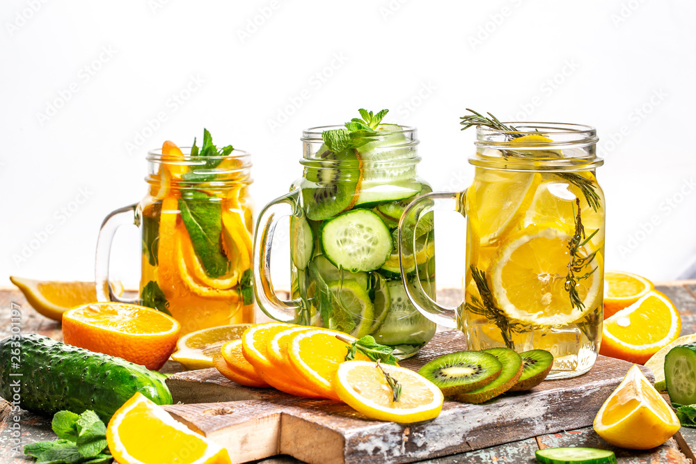 Cucumber and Lemon Detox Water. Homemade detox drink. diet healthy eating and weight loss. White wooden background. Copy space Cucumber and Lemon Detox Water. Homemade detox drink. diet healthy eating and weight loss. White wooden background. Copy space