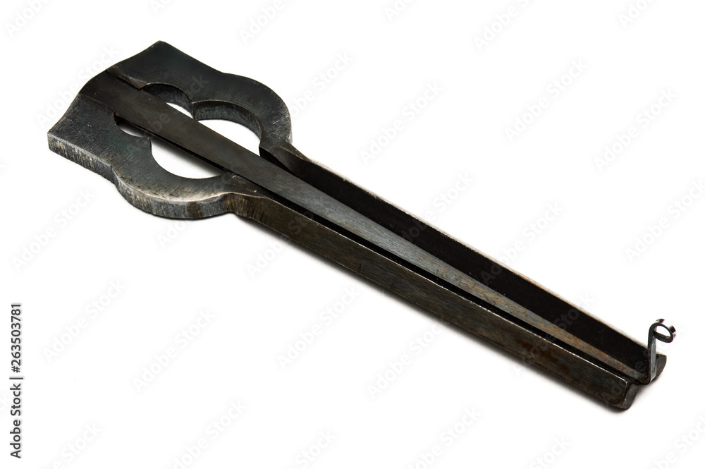 Jew's harp lamellophone handmade instrument with corrosion-resistant coating isolated on white background Jew's harp lamellophone handmade instrument with corrosion-resistant coating isolated on white background