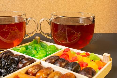 Oriental sweets, dried fruit with a cups of tea