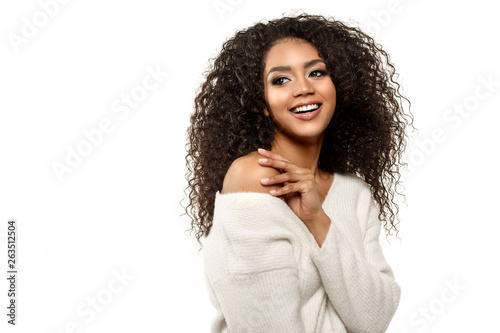 Beauty black skin woman African Ethnic female face. Young african american model with long afro hair.Smiling model isolated on white background.