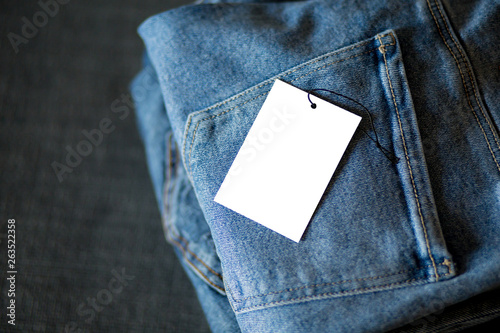 Stack of blue demin in retail store for sale. photo