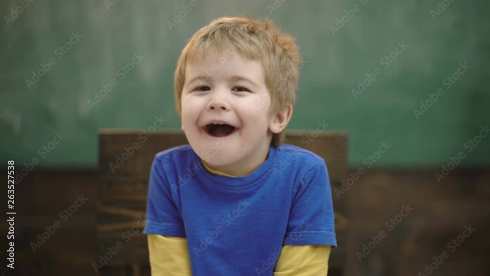 Close up portrait of a happy boy smiling on a wooden background. Joyfull little child. Happy and excited. Portrait of attractive laughing toddler boy. Portrait of laughing boy on green background. Close up portrait of a happy boy smiling on a wooden background. Joyfull little child. Happy and excited. Portrait of attractive laughing toddler boy. Portrait of laughing boy on green background.