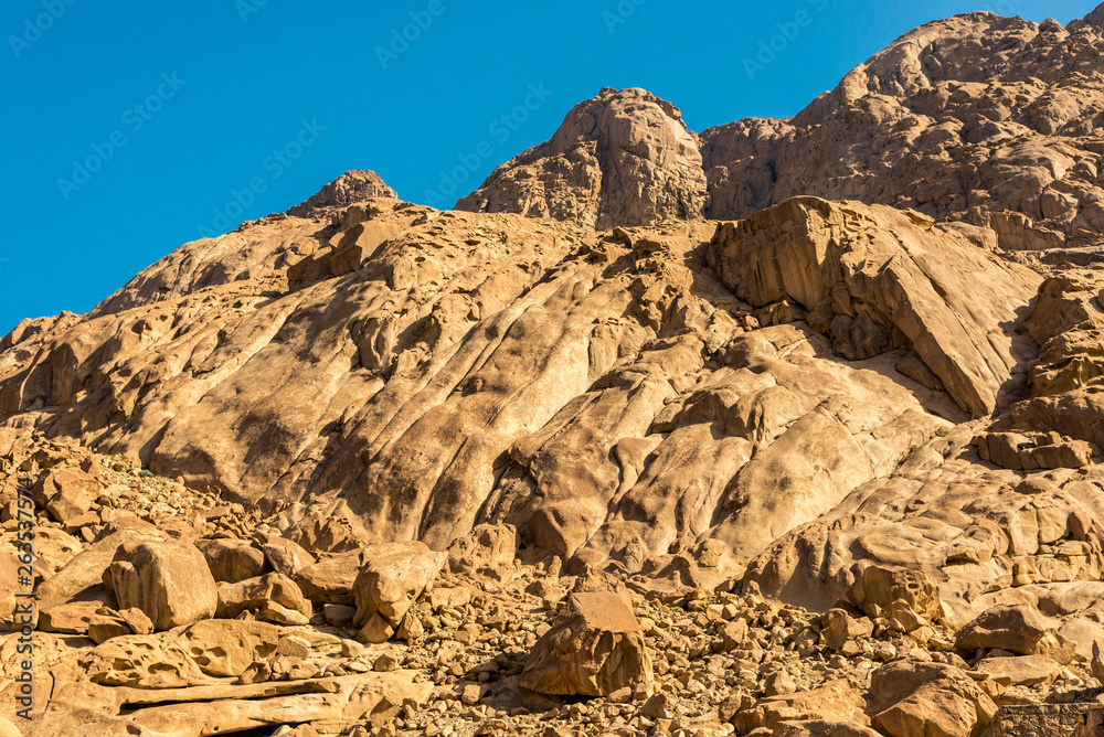 Fototapeta premium Middle East or Africa, picturesque bare mountain range and a large sandy valley desert landscapes landscape photography