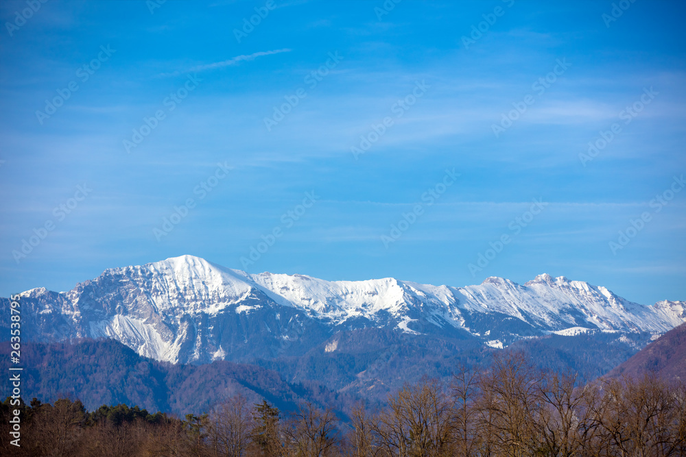 Mountains covered with snow. Beautiful wild nature of Alps