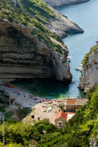 People enjoying summer in Stiniva cove, Vis island - Croatia. 