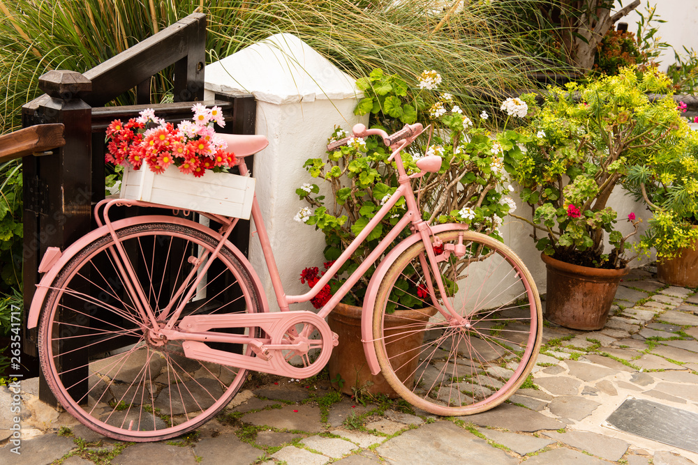 old vintage shabby chic pink recycled upcyckled bicyckle made into a flower holder