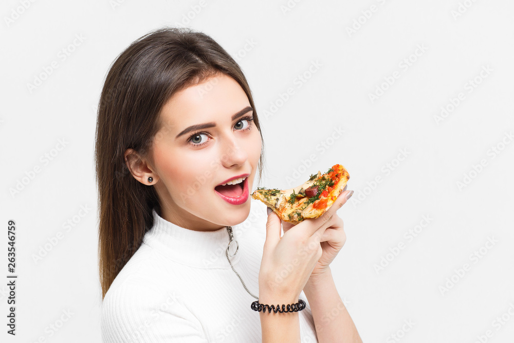 Portrait of pretty  model , eating slice of pizza, isolated on white!
