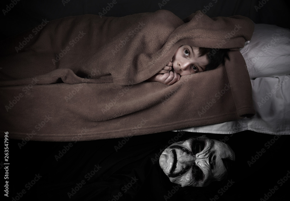 Foto de Little boy and monster under the bed. Bad dreams concept. do