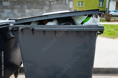 Black plastic trash containers for separate collection and sorting of garbage for environmental protection