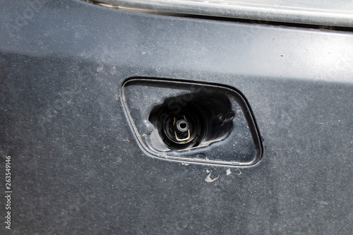 Close-up open headlight washer nozzle without car cover