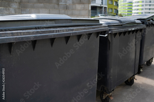 Black plastic trash containers for separate collection and sorting of garbage for environmental protection
