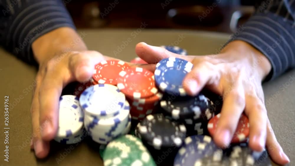shoving poker chips at the gambling table in slow motion
