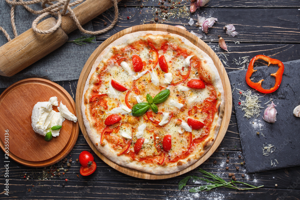 Hot pizza with tomato and Bulgarian pepper