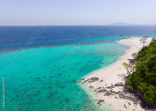 Aerial view of the beach on an island in the blue ocean