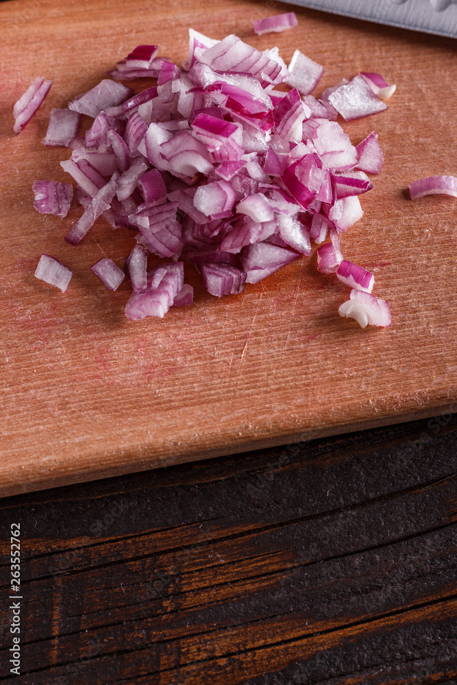 red onion cut on a wooden board