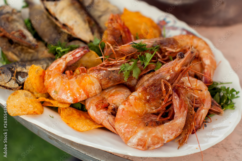 Sea food dishes in plates on the table Sea food dishes in plates on the table